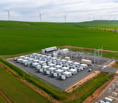 Future Bendigo BESS Site - artist's impression of large green fields with a section occupied by large batteries.